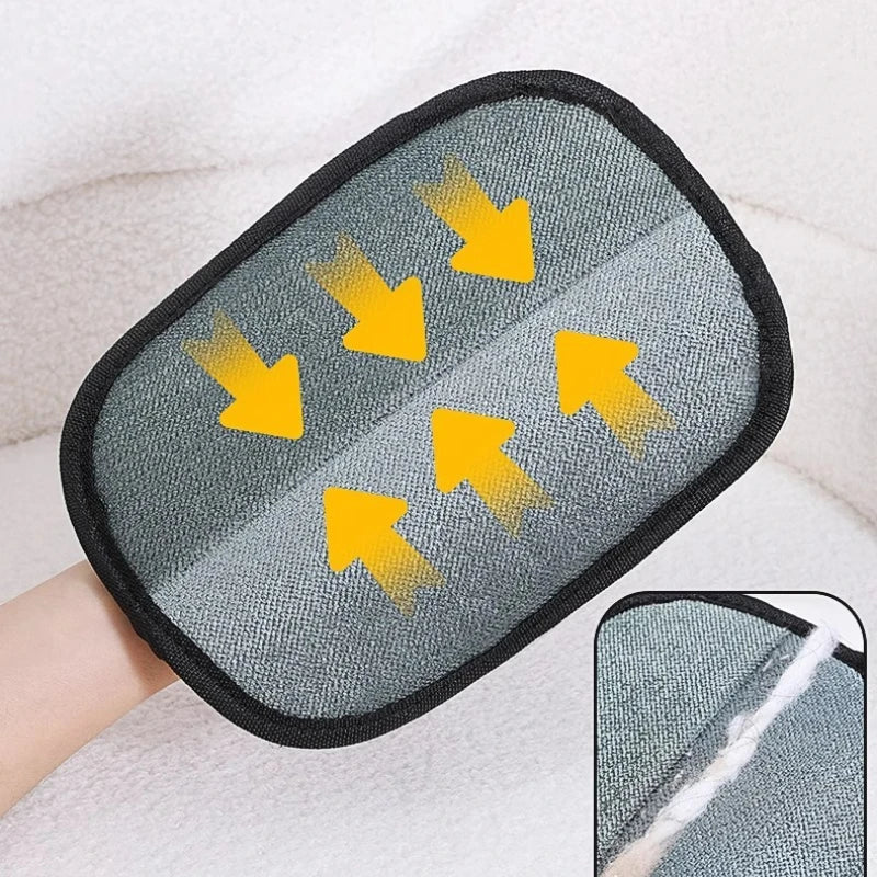 Gray wiping pad of the glove with arrows showing the wiping direction