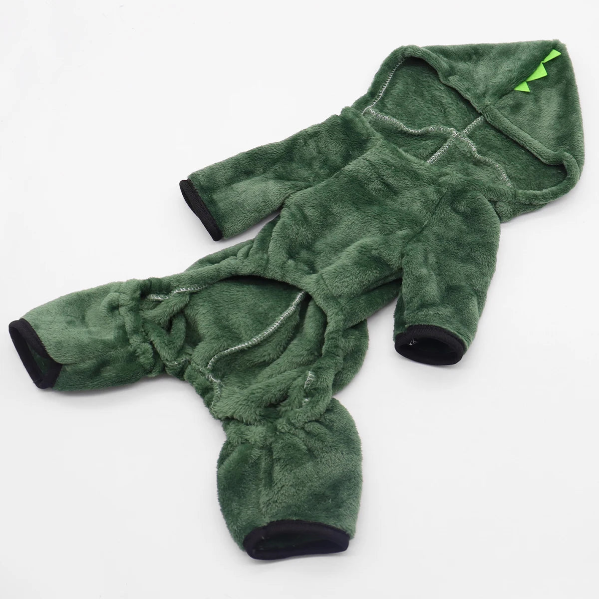 Underside of the green dinosaur jumpsuit laid flat, showing the four legs with black ribbed cuffs