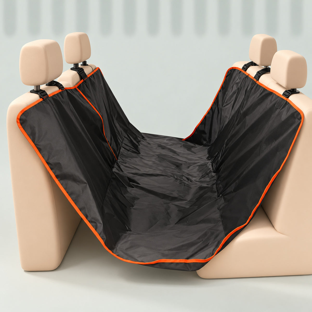Black hammock seat cover with orange trim hung between two seat-shaped blocks