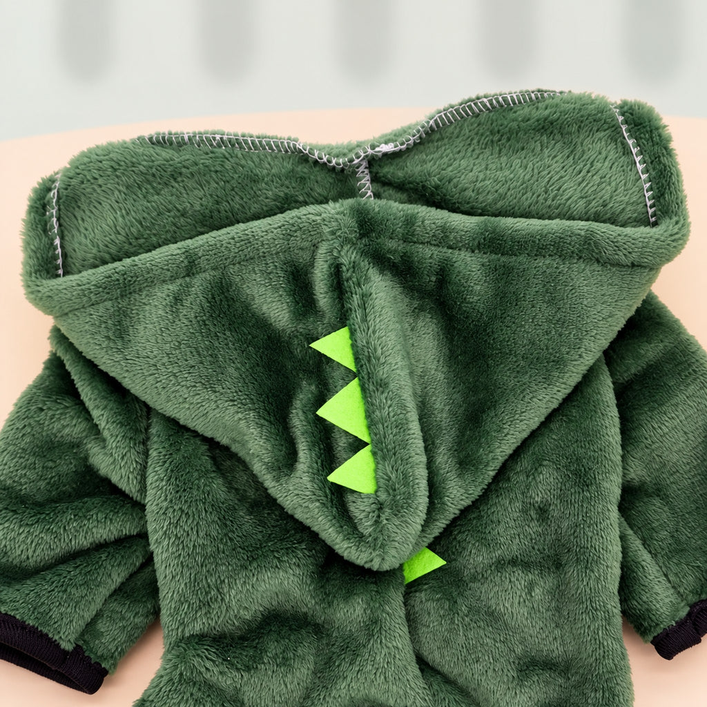 Close-up of the jumpsuit's hood: lime-green fabric spikes on dark green plush fleece