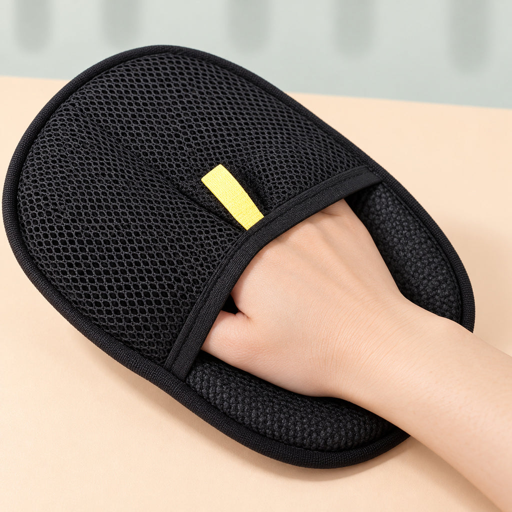 Close-up of a hand sliding into the glove's mesh pocket under the elastic band