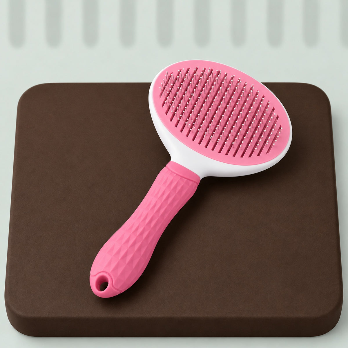 Pink and white self-cleaning slicker brush